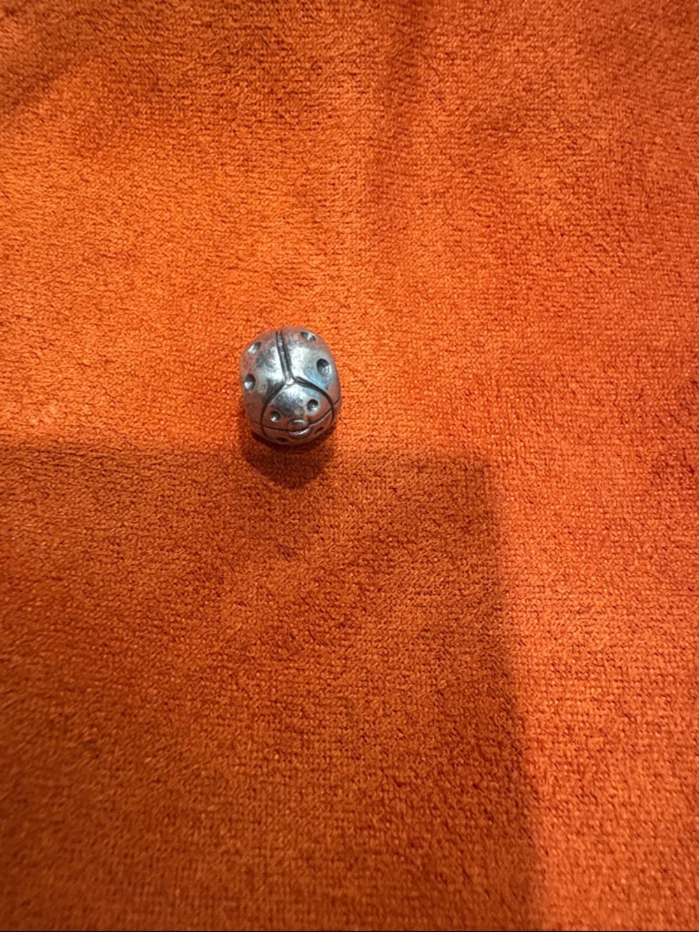 Pandora Silver Ladybug Charm on Orange
